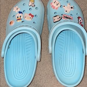 Women’s light blue crocs, barely worn. with charms
